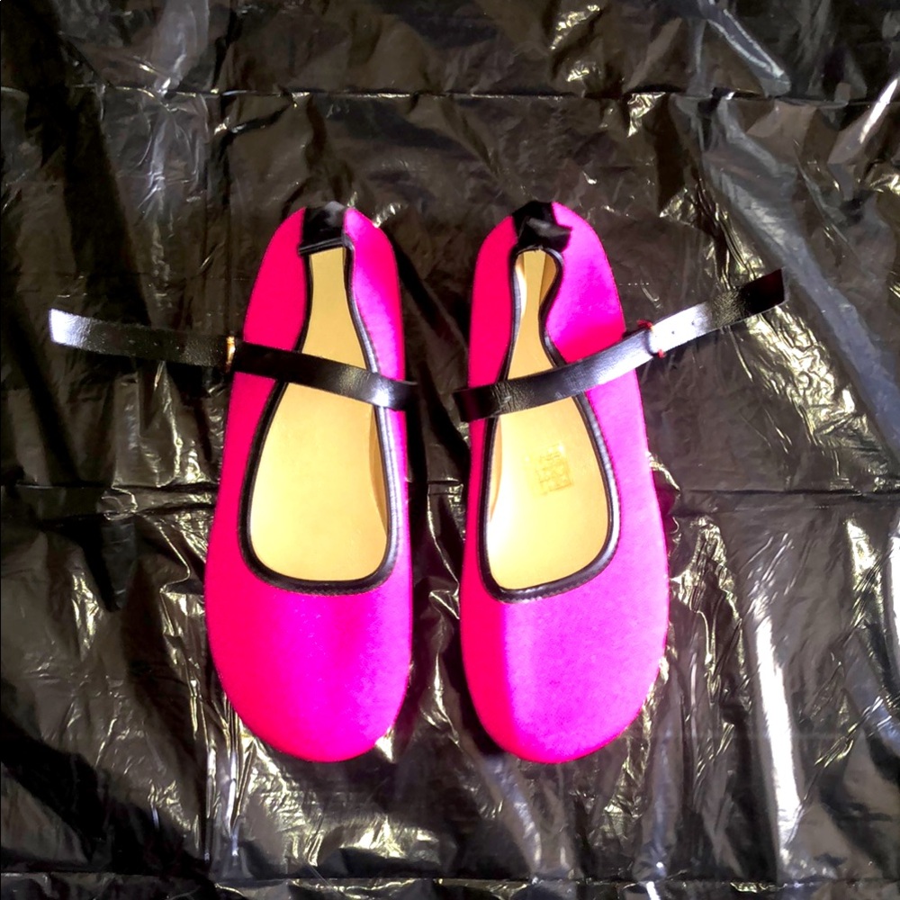 Bright pink flats with adjustable straps